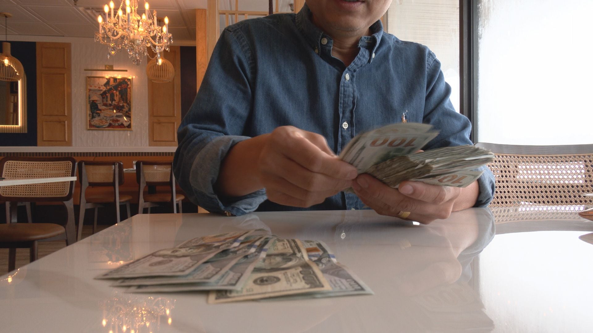 Grand Strand restaurant owner finds $12,000 in cabinet, returns it to previous owner