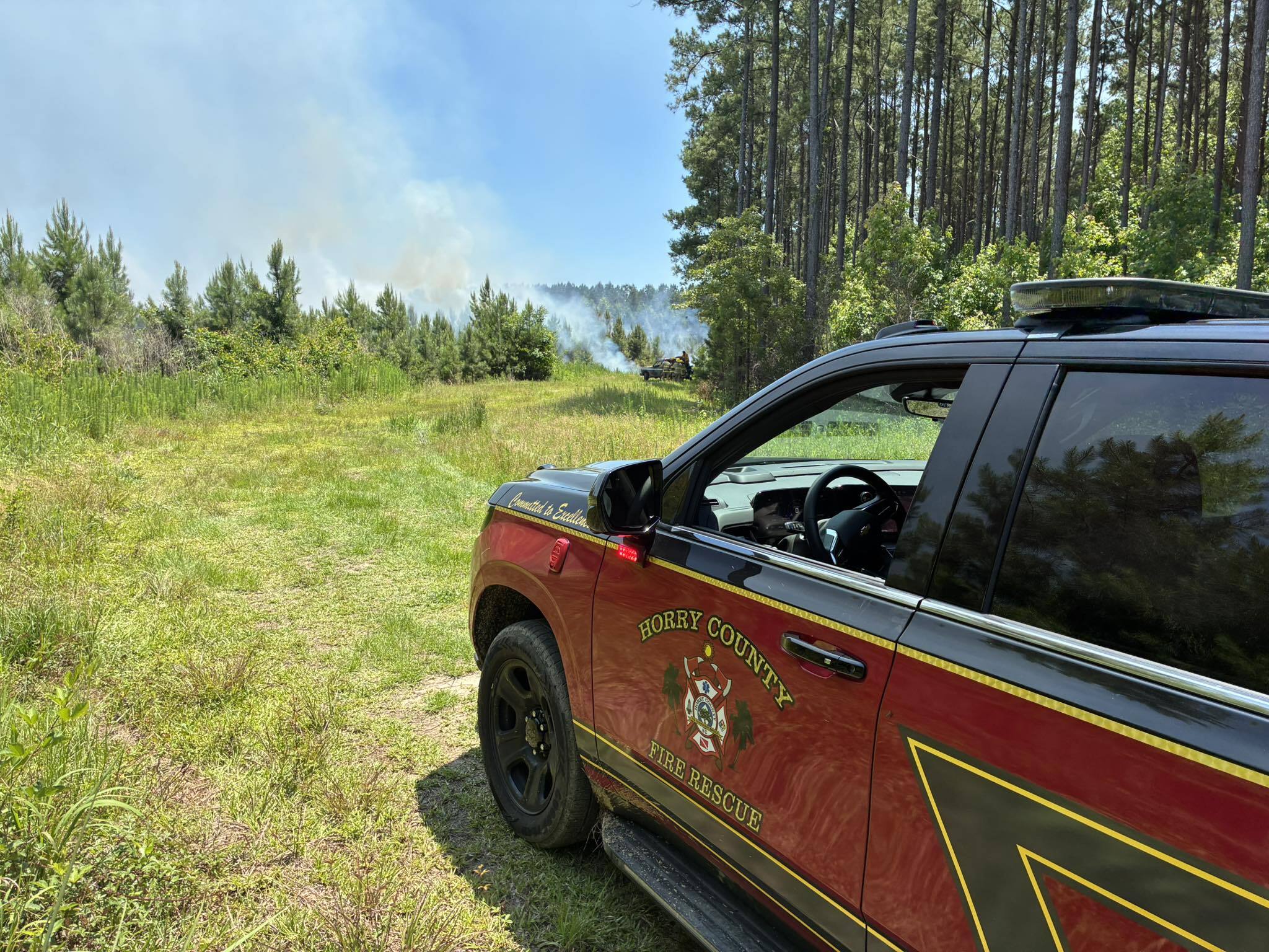 Crews working to contain Nichols-area woods fire