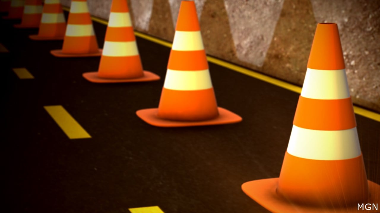 Road blocked after truck overturns, spills rocks on Highway 22