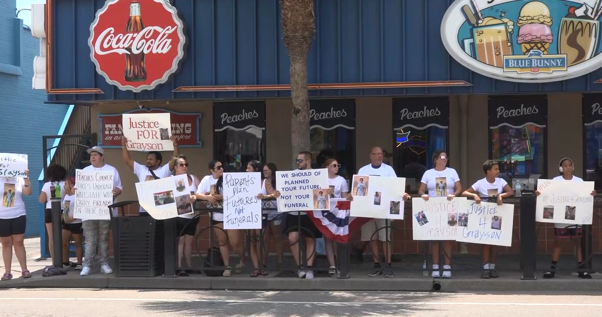 ‘The killing needs to stop’: Loved ones protest, call for accountability 1 year after deadly Peaches Corner shooting