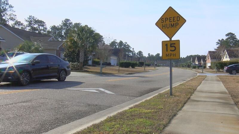 A car travels over a speed hump in an Horry County neighborhood.