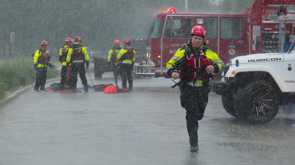 Members of the Boerne Fire Dept. prepare to perform a water rescue on Wednesday, July 15,...
