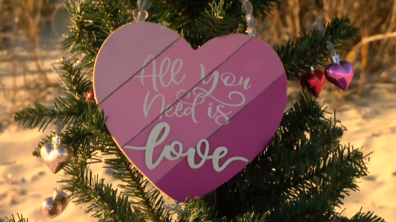 A Christmas tree placed on the beach is spreading love this holiday season.