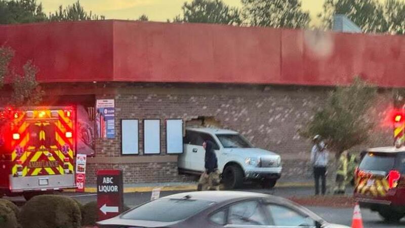 Two people are hurt after a truck went through the side of a gas station in the Myrtle Beach...