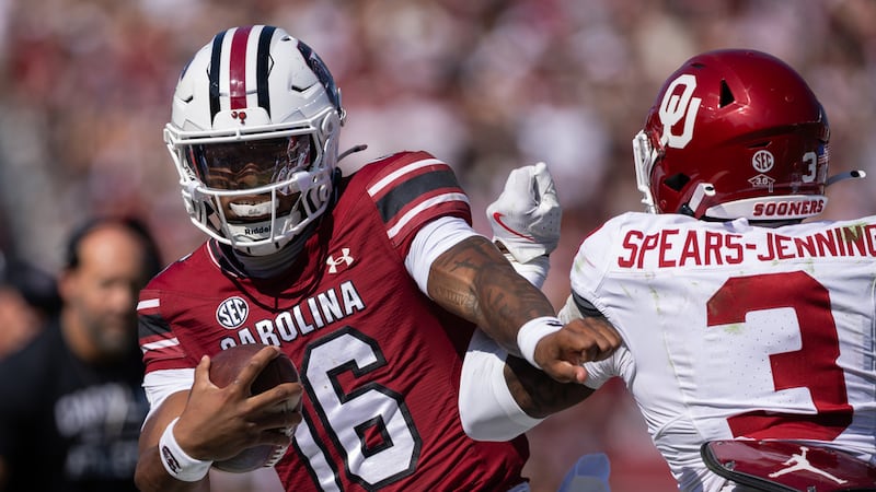 South Carolina quarterback Lanorris Sellers (16) is forced out of bounds by Oklahoma defensive...