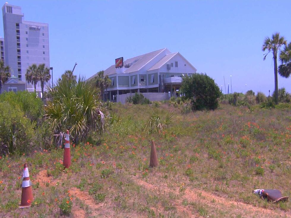 The land where the city wants to put the courts is Between Springmaid Beach Resort and...